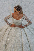 Impresionante vestido de novia de lujo con mangas largas y gala.
