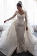 Impresionante vestido de novia de sirena con encaje y lazo, con falda desmontable y mangas largas.