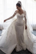 Impresionante vestido de novia de sirena con encaje y lazo, con falda desmontable y mangas largas.