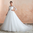Wunderschönes langes A-Linien-Brautkleid aus Tüll mit Applikationen und Ärmeln